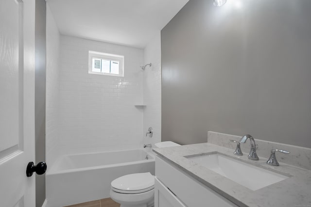 full bathroom featuring vanity, bathtub / shower combination, and toilet