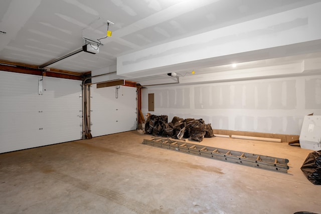 garage with electric panel and a garage door opener