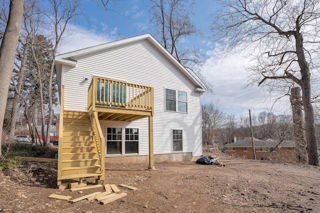 back of property with stairs