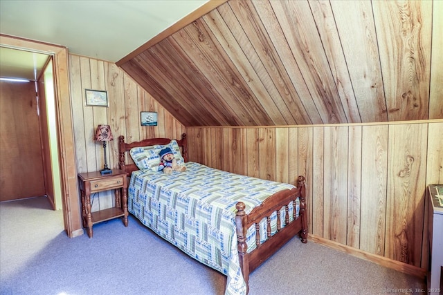 bedroom featuring wood walls, wood ceiling, lofted ceiling, and carpet