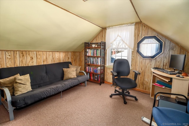 office featuring carpet, wood walls, and vaulted ceiling