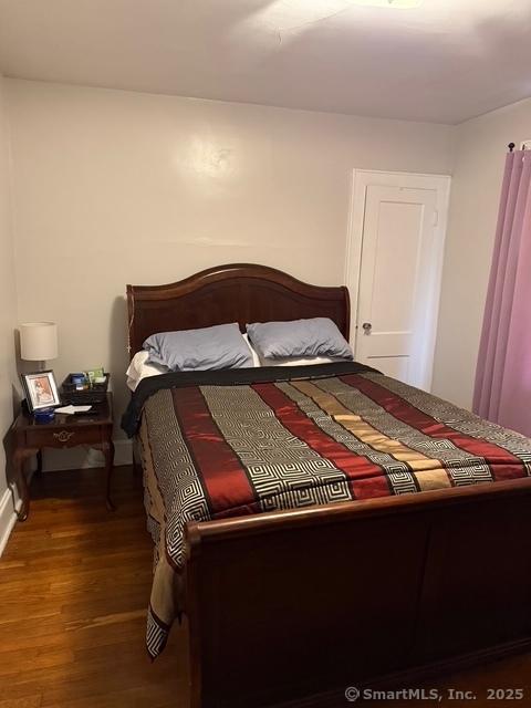 bedroom featuring wood finished floors