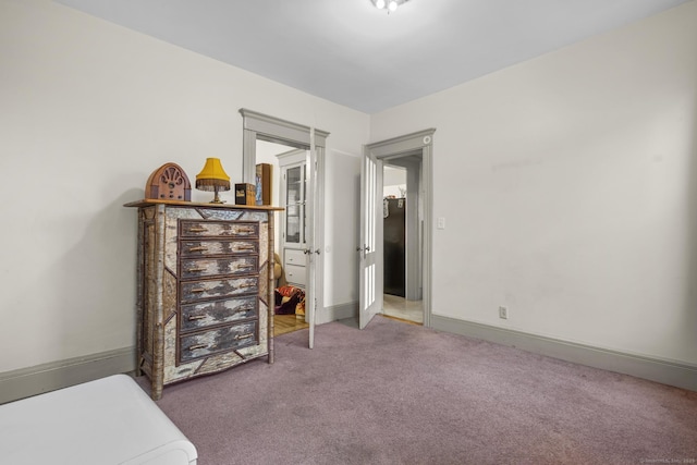 bedroom featuring carpet flooring and baseboards