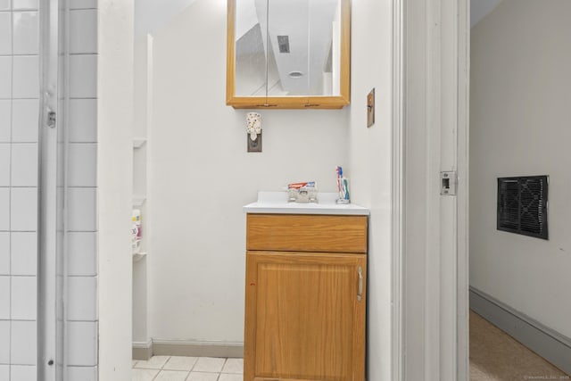 bathroom with baseboards, visible vents, and vanity