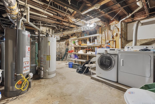 unfinished basement featuring gas water heater and separate washer and dryer