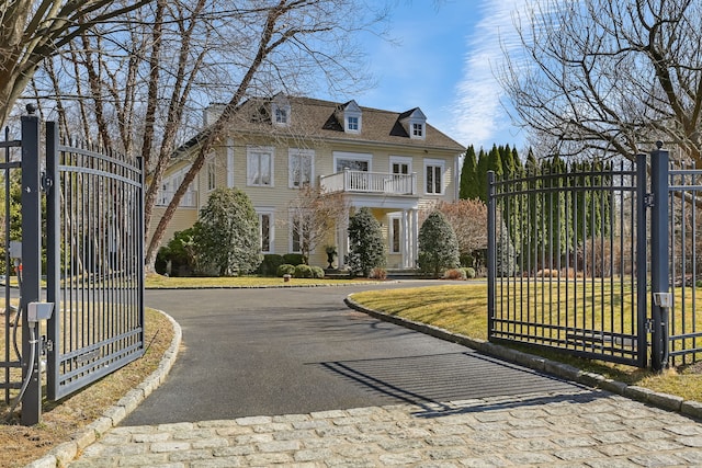 view of gate with fence