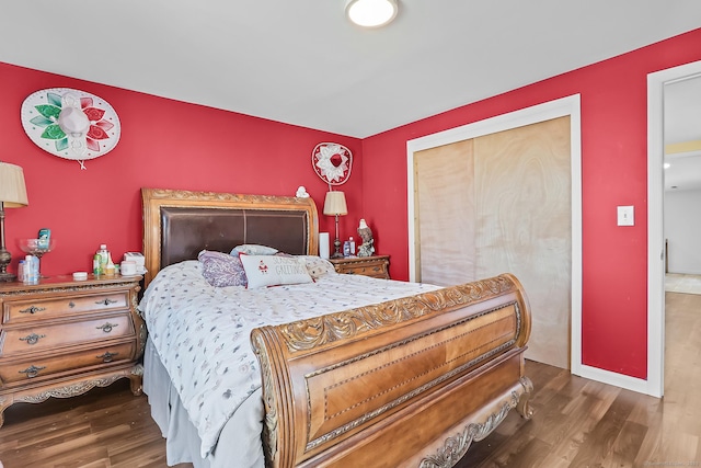 bedroom with wood finished floors