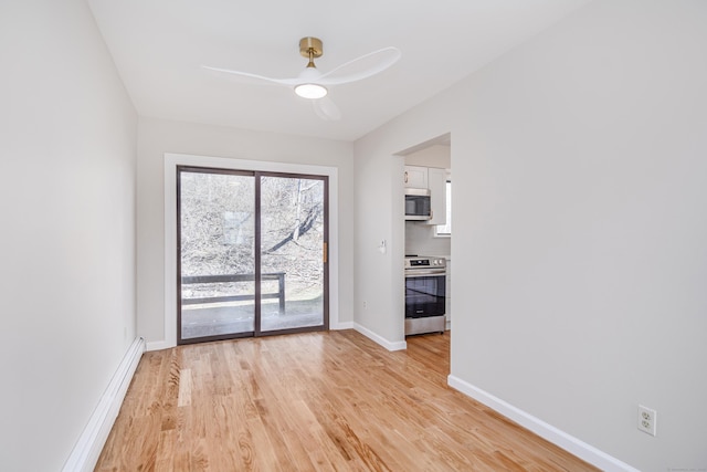 unfurnished room with a baseboard heating unit, light wood-type flooring, a ceiling fan, and baseboards