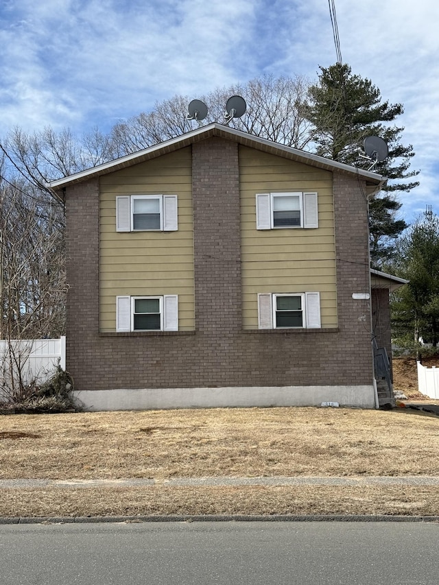 view of home's exterior featuring brick siding