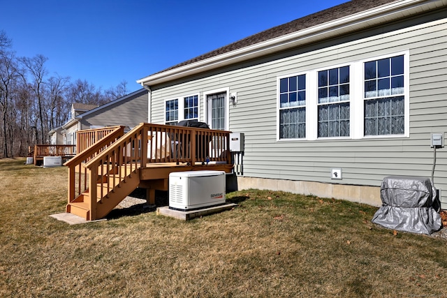 exterior space with a yard, stairs, and a deck