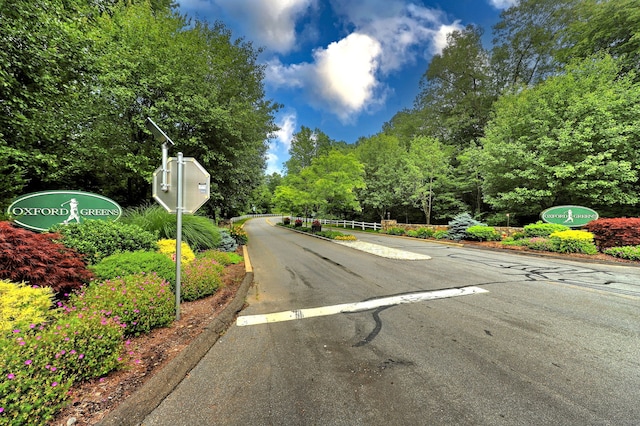 view of street with traffic signs and curbs