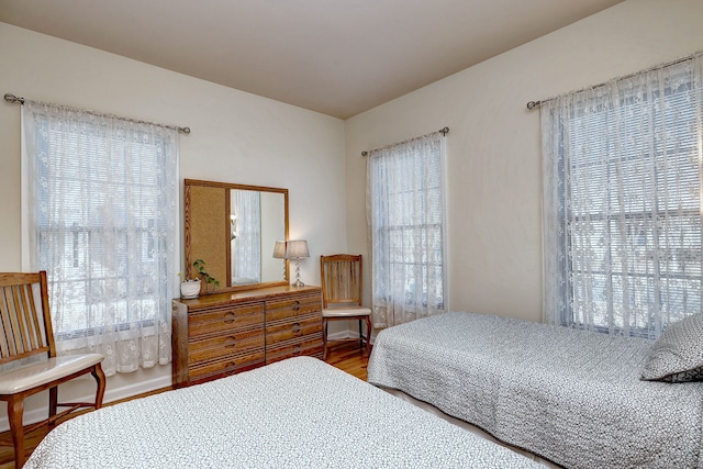bedroom with wood finished floors