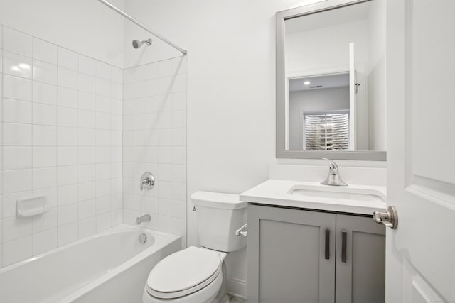 bathroom featuring shower / bath combination, vanity, and toilet