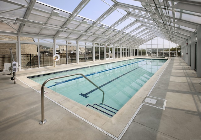 community pool featuring a patio area and a lanai