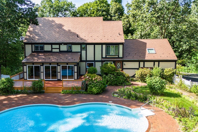 view of pool featuring a fenced in pool, a deck, and fence
