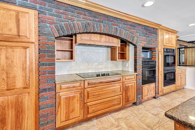 kitchen featuring black appliances, tasteful backsplash, open shelves, and stone countertops