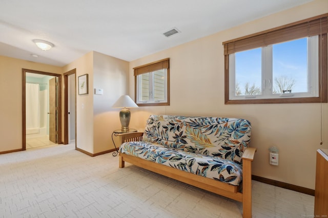 living room featuring baseboards and visible vents