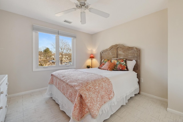 bedroom featuring visible vents, a ceiling fan, and baseboards