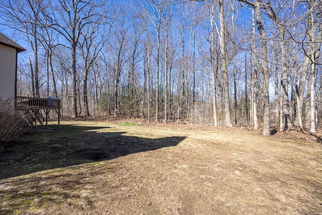 view of yard featuring a wooden deck