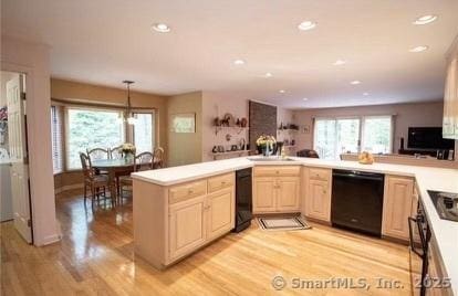 kitchen featuring light wood-type flooring, light brown cabinetry, black dishwasher, recessed lighting, and light countertops