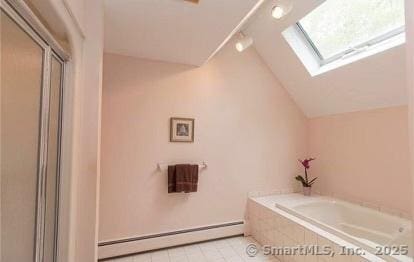 bathroom featuring lofted ceiling with skylight, a shower with door, a bath, and a baseboard radiator