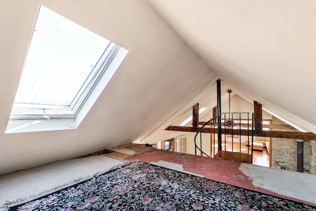 additional living space with lofted ceiling with skylight