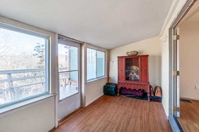 sunroom with lofted ceiling