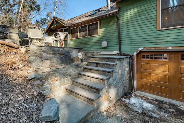 view of side of home with a garage