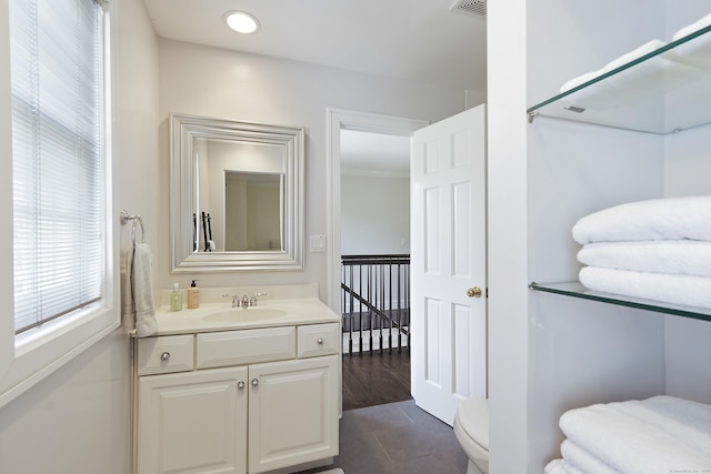 bathroom featuring vanity, tile patterned floors, toilet, and recessed lighting