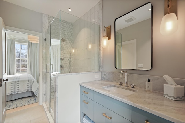 ensuite bathroom featuring vanity, visible vents, ensuite bath, tile patterned flooring, and a shower stall