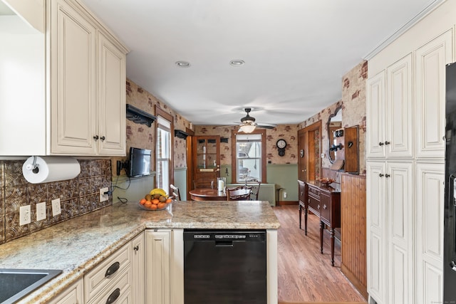 kitchen with cream cabinets, light wood-style flooring, a peninsula, a ceiling fan, and dishwasher