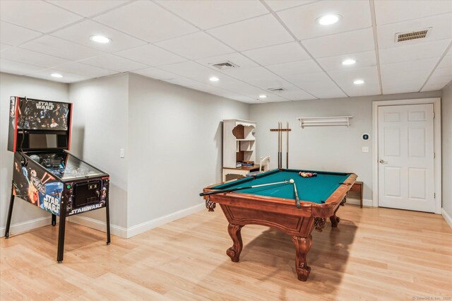 game room featuring light wood-style flooring, baseboards, and visible vents