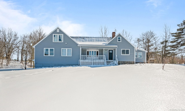 view of front of home featuring a porch and a chimney