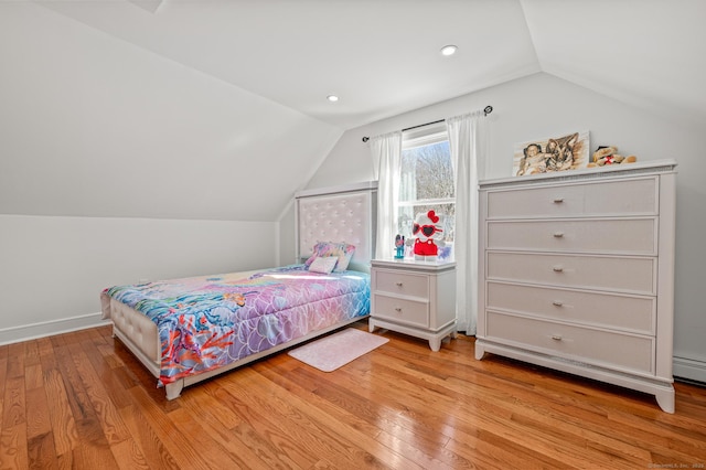 bedroom with lofted ceiling, hardwood / wood-style floors, and recessed lighting