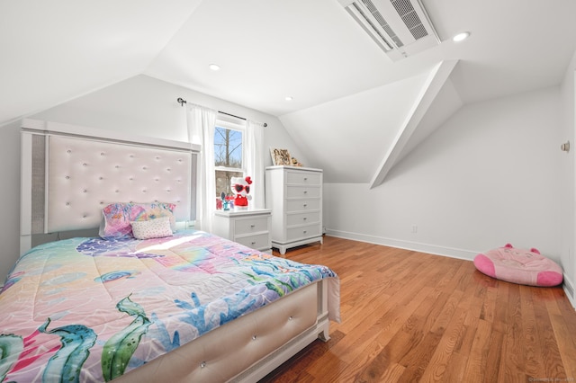 bedroom with baseboards, visible vents, wood finished floors, vaulted ceiling, and recessed lighting