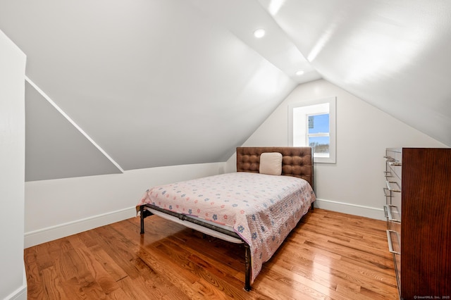 bedroom with light wood-type flooring, baseboards, vaulted ceiling, and recessed lighting