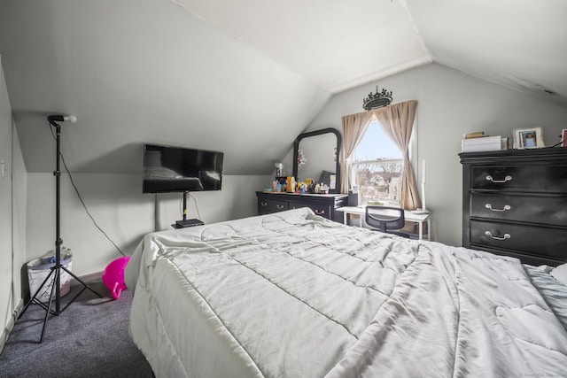 carpeted bedroom featuring vaulted ceiling