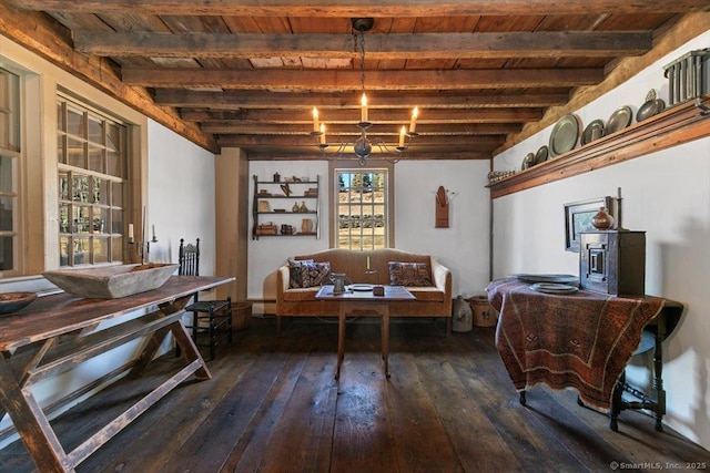 dining space with dark wood-style floors, a baseboard radiator, wooden ceiling, beamed ceiling, and a chandelier