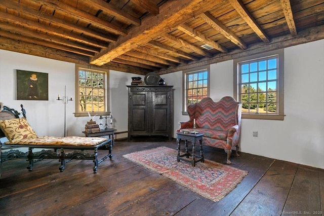 living area with beamed ceiling, wood ceiling, and hardwood / wood-style flooring