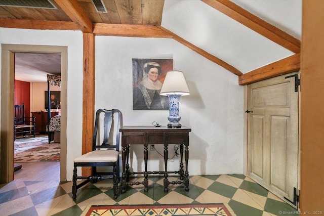 interior space featuring tile patterned floors, visible vents, and lofted ceiling with beams