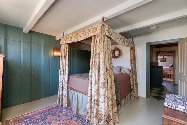 bedroom with beam ceiling