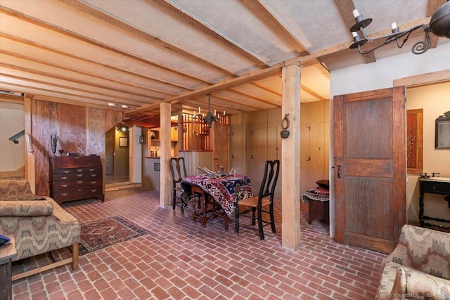 dining area with brick floor