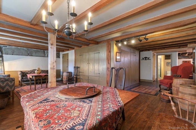 dining room featuring a chandelier, beam ceiling, and hardwood / wood-style floors