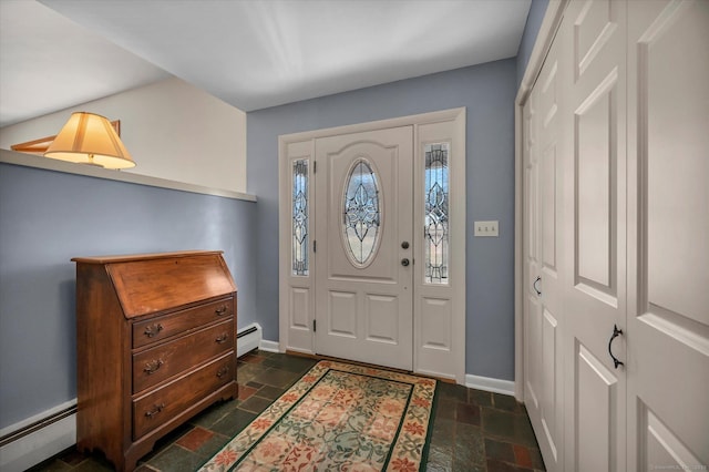 entrance foyer with baseboards, baseboard heating, and stone tile floors