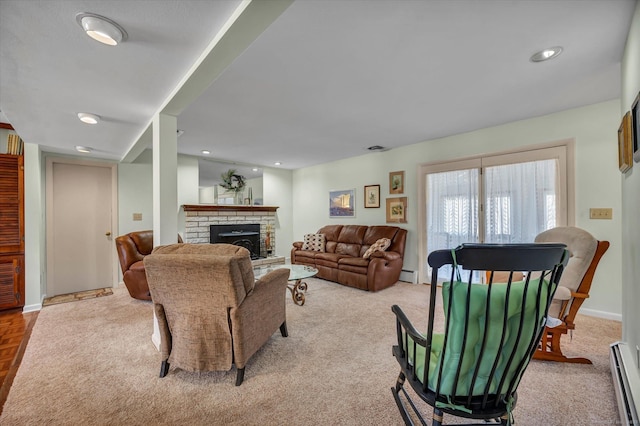 living room featuring a baseboard radiator, a fireplace, baseboards, and recessed lighting