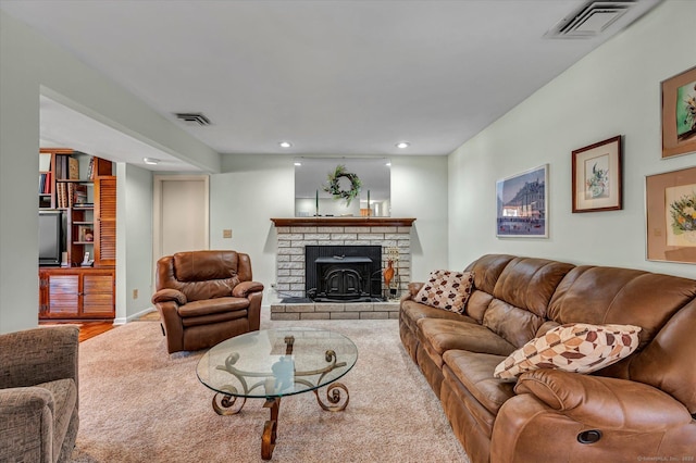 living room with visible vents, wood finished floors, and recessed lighting