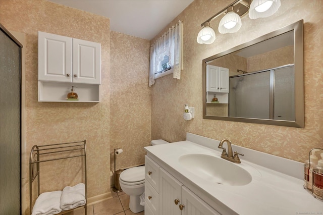 bathroom with wallpapered walls, toilet, a stall shower, vanity, and tile patterned floors