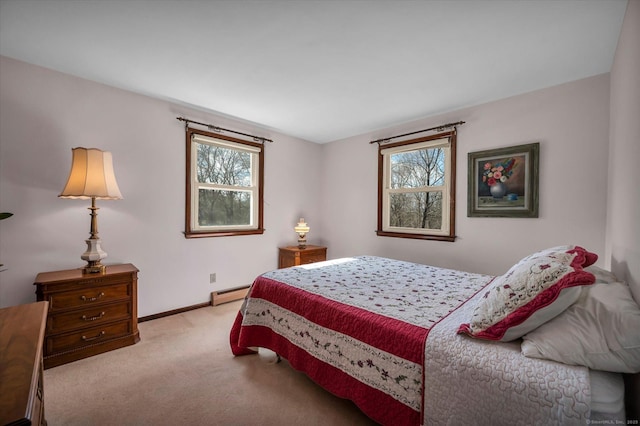 carpeted bedroom featuring baseboards and baseboard heating