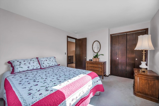 carpeted bedroom with a closet