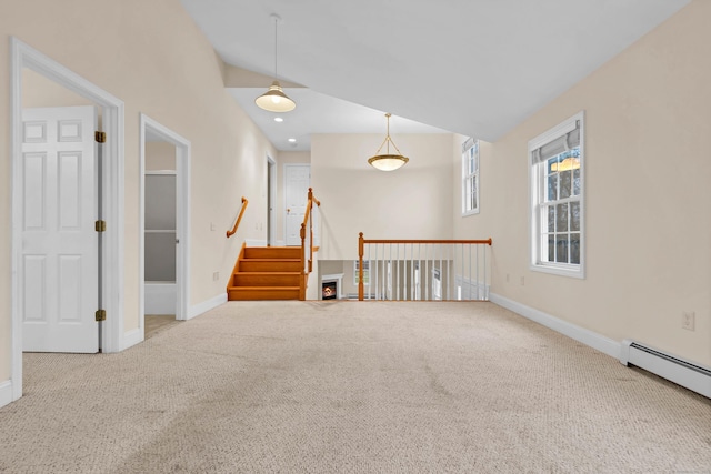 carpeted spare room with a baseboard heating unit, vaulted ceiling, recessed lighting, and baseboards